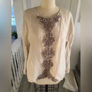Beige long sleeve jacket.